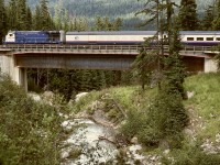 In 1995, Canadian Pacific closed the Connaught Tunnel route to allow deepening the tunnel to accommodate double-stacked container trains, requiring the Macdonald Track to carry both eastward and westward traffic, including Rocky Mountaineer passenger trains.  On Wednesday 1995-08-09, eastward GCRC 7488 crossed the Bear Creek bridge at Macdonald Track mileage 78.7M at 1433 PDT, just before entering the Shaughnessy Tunnel.