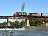  Today, the 18th of September, was an especially nice day to be out. Perfect temperature, clear skies and the bugs were out partying somewhere, I guess.
CN's 580 followed 502 over the bridge at Caledonia and 3/4 the way across gave us a little 'whoop' of the throttle.  Made for an okay shot worth sharing.  CN 4138 and GTW 4616.
