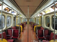 The interior of TTC H5 subway car 5791 is shown empty, at the end of the line at Finch Subway Station one evening. Empty interior shots could be tricky to get, but end terminus stations late at night (10pm) made it a bit easier, except for the errant hats and mitts and newspaper bits scattered about from a day of riding around Toronto in service.<br><br>The distinct yellow doors and doorways were original to the H5-class of subway cars (5670-5807) when built new by Hawker Siddeley Canada the mid-1970's, but they originally featured orange velour seat inserts (eventually changed to red fabric, as seen here). TTC 5791 was one of the last cars to operate in service, on the final H5 train run on June 14th 2013.<br><br>More H5's:<br><br>Platform view at Finch: <a href=http://www.railpictures.ca/?attachment_id=10050><b>http://www.railpictures.ca/?attachment_id=10050</b></a><br>Operator's cab interior: <a href=http://www.railpictures.ca/?attachment_id=59834><b>http://www.railpictures.ca/?attachment_id=59834</b></a><br>New on delivery: <a href=http://www.railpictures.ca/?attachment_id=53581><b>http://www.railpictures.ca/?attachment_id=53581</b></a><br>Meeting a CP freight: <a href=http://www.railpictures.ca/?attachment_id=54660><b>http://www.railpictures.ca/?attachment_id=54660</b></a><br>At Dundas Subway Station: <a href=http://www.railpictures.ca/?attachment_id=34900><b>http://www.railpictures.ca/?attachment_id=34900</b></a><br>At the scrapyard: <a href=http://www.railpictures.ca/?attachment_id=7336><b>http://www.railpictures.ca/?attachment_id=7336</b></a>