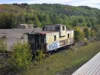 <b> Forlorn Van </b> <br> 
BCOL 1884 sits abandoned on an overgrown backtrack in the BC interior along CN's Bulkley Sub. near Andimaul, BC. <br> 
Searching the internet, I read that BCOL 1884 was the cab on the last caboose equipped train on BC Rail that departed Fort St. John for Fort Nelson on August 12, 2004. <br>
My photo is 22 years later on September 4, 2026. <br>
BC Rail, CN, and VIA Rail all represented in this photo. Location approximate.