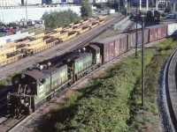 A business trip to Vancouver in 1995 gave me the opportunity to spend a Sunday shooting in the Vancouver area. While scouting locations to photograph the afternoon Amtrak departure from the Pacific Central station, I came across BN 194 and 192 (both former Northern Pacific SW1200s) which I believe were bringing cars from the nearby interchange yard (with CN and Southern Railway of British Columbia/former BC Hydro). This is still a BN train...the BNSF merger will take place 12 days from now (22 September 1995).