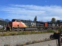 <b> Cans west </b> <br>
CN 2329 with CN 8878 in tow and a lengthy train of double stacks has just cleared the Hazel Ave. crossing at the west end of Japer Yard to continue the westbound journey with a fresh crew on board. <br>