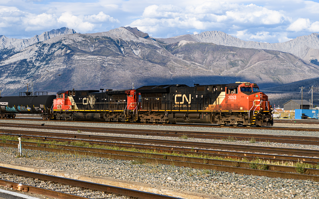 I don't smell anything  
CN 3053 & CN 2515 lead a westbound unit train of tank cars all stenciled 'Liquified Petroleum Gas Non-odorized' through the yard at Jasper, AB on September 1, 2026. 
The CN North American logo on CN 2515 is holding up much better than the cab side paint.  
A tip of the hat to LP for his exceptional editing of this photo.