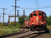 Hot summer's day, end of July, and I was shooting everything this day. Being out for nearly 8 hours, this was near the start. After some training of office personnel at Nith Rd (Paris West), and clearance of other trains in the area...the conductor hopped back into the cab of 4119. With a puff of exhaust, they're back on their way to the yard in Brantford. 