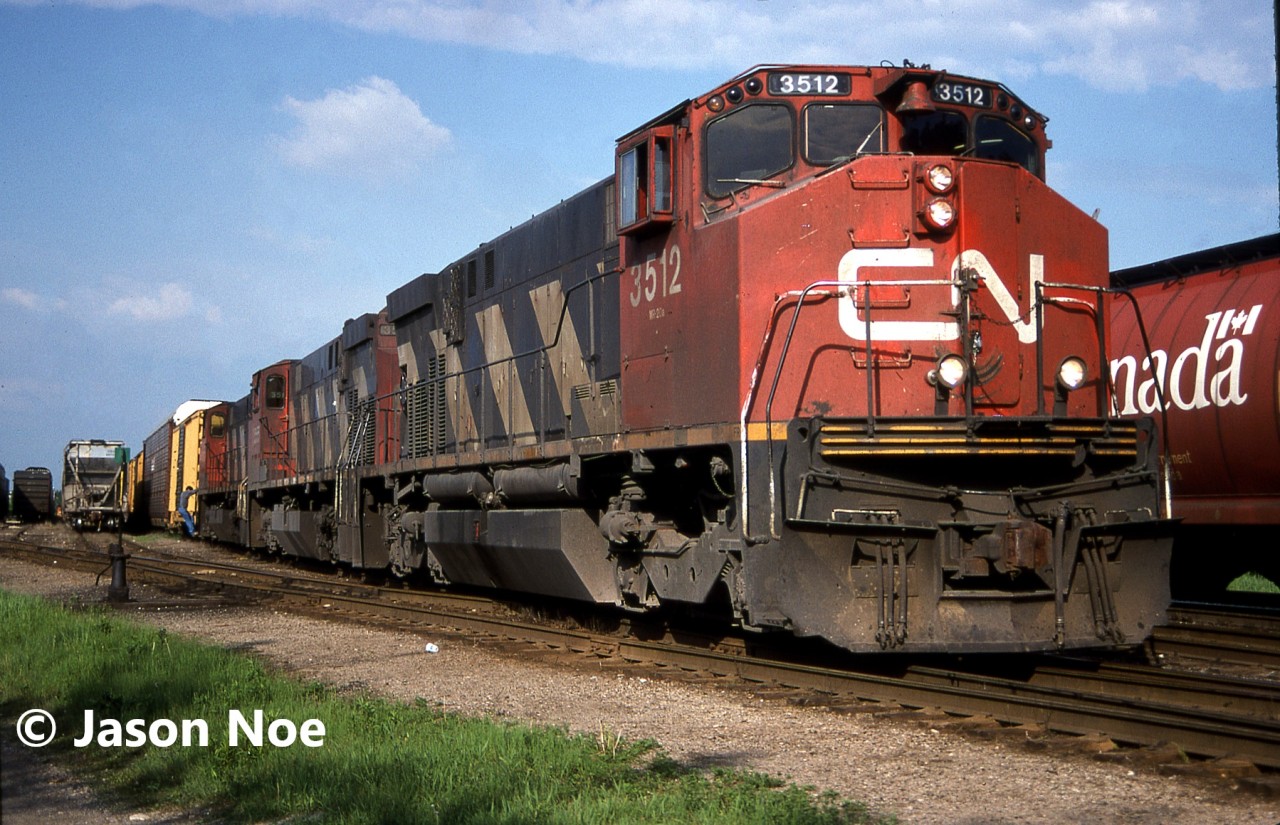 CN 431 with M420(W)’s 3512, 3555 and 3560 are pictured in the yard at Kitchener, Ontario. The crew had just completed their set-off and would soon depart west on the CN Guelph Subdivision for London.