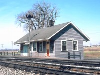 <b> Caption: </b>
<br>
<br>
Once home for the Massey family, this village was incorporated in 1856. Coincidentally, during the same year the Grand Trunk Railway completed its line, initially building a limestone station, similar to those still standing at Port Hope, Napanee and Prescott. 
<br>
<br>
CN Newcastle Station, circa 1960.
<br>
<br>
For those who have pit stopped at the 401 On Route west of Port Hope, you would've viewed a mural of the full structure at its peak. This was the second structure, as it replaced the limestone structure when the GTR double tracked their mainline. By now, the large baggage area was truncated as traffic started to decline. 
<br>
<br>
Bonus to those who can identify the year and make of the pickup, travelling along Toronto Street - today, it's an industrial park.
<br>
<br>
For the full history, you can go to the <a href="https://www.trha.ca/history/stations/newcastle-station-grand-trunk-railway/"> THRA website. </a>
<br>
<br>
<i> Photographer Unknown, photo provided to me by the late Dave Savage, Canadian Railway Station News. </i>