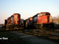 CN 395 is pictured in the yard at Kitchener, Ontario after taking the siding for VIA 89 and to lift the loaded auto frame cars seen to the left. Powering 395 are SD40-2(W) 5317 and GTW SD40-2 5930, which would soon begin lifting their cars, once the 15:30 Kitchener Job would clear the yard with GP9RM 7030. The auto frames were manufactured at the massive Budd automotive frame plant in Kitchener situated on the Huron Park Spur.