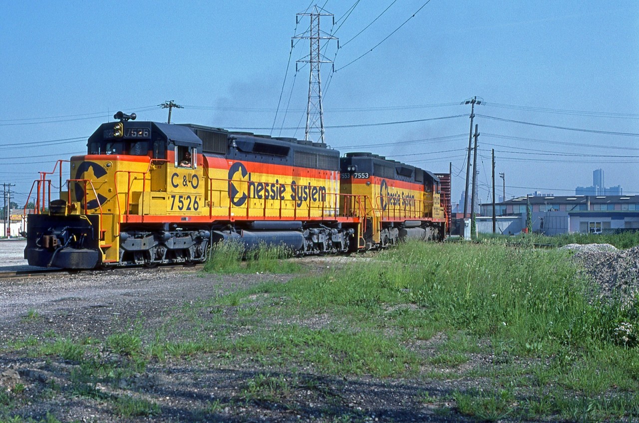 C&O 7526/7553, with the daily transfer "The Puller", are seen departing the CP's Windsor Yard. They are briefly on the Essex Terminal before getting on the loop track over to CN and CP's CASO Sub for a trip through the Detroit River Tunnel as they make their way back to Rougemere Yard in Dearborn Michigan. This is a scan of a Bernie Drouillard Kodachrome original and posted with permission.