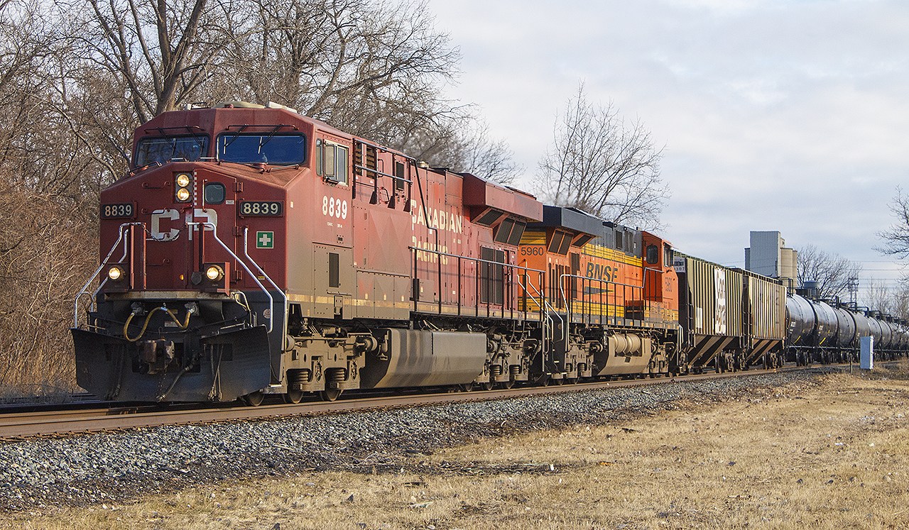 Before CP and the KCS merged, there was always an eclectic mix of power borrowed from other roads. Here, CP 8839 leads with BNSF 5960, then known as train 651 - the oil train.
