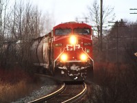 I was travelling to Napanee to spend the night with family, in preparation for a job interview the next day. At Oshawa, is when I first spotted this train. I knew when, and where I could snap a photo of it. 
<br>
<br>
With minutes to spare, due to some inclement weather so popular in this area, I made it to the George Street entrance just in time. Here, 8873 and second unit 9673 lead this eastbound train charging around the bend at Cobourg, on the Belleville Subdivision. 