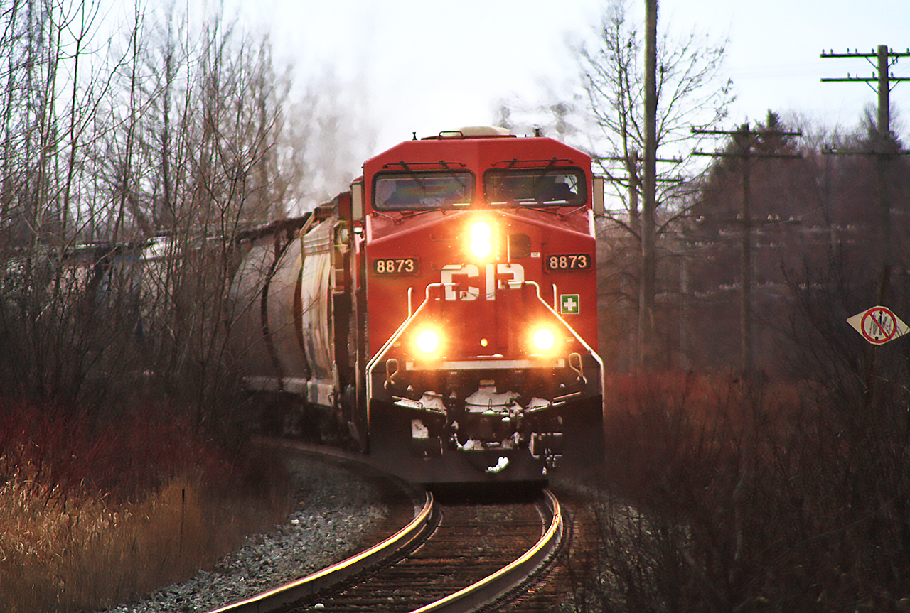 I was travelling to Napanee to spend the night with family, in preparation for a job interview the next day. At Oshawa, is when I first spotted this train. I knew when, and where I could snap a photo of it. 


With minutes to spare, due to some inclement weather so popular in this area, I made it to the George Street entrance just in time. Here, 8873 and second unit 9673 lead this eastbound train charging around the bend at Cobourg, on the Belleville Subdivision.
