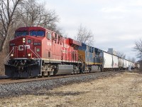 This day proved to be absolutely wonderful for any railfan. Sometimes, here along the old Windsor Subdivision in Chatham, one can witness two trains within half hour of each other at times. 
<br>
<br>
I'm not sure of what the circumstances were from this day, but here's another great lashup. CP 9974 with a CSX engine trailing, are leading train 141 through Chatham. This was only approximately 15 minutes before <a href="http://www.railpictures.ca/?attachment_id=59942"> CP 651 came through with a BNSF unit. </a>