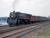 Canadian Pacific Railway G3g "Pacific" 2399 (built by CLC in September 1942, scrapped September 1961) flies white extra flags leading a passenger train eastbound out of CN's Sunnyside Station, exercising running rights over CN's Oakville Sub enroute to Toronto Union Station. It's seen passing traffic on the nearby <a href=http://www.railpictures.ca/?attachment_id=2581><b>Gardiner Expressway</b></a>, that runs parallel to the rail corridor on this stretch.<br><br>The train number wasn't listed on this slide, and the train consist appears to be different than the <a href=http://www.railpictures.ca/?attachment_id=40263><b>NYC-TH&B-CP train #322</b></a> (New York to Toronto) that John Street-based 2399 often operated on. The date also wasn't listed on this slide, but it appears to be mid-to-late 1950's shot. Perhaps one of the RP.ca viewers more knowledgeable about 50's Toronto-area steam operations has some insight.<br><br> <i>Original photographer unknown (duplicate), Dan Dell'Unto collection slide.</i>