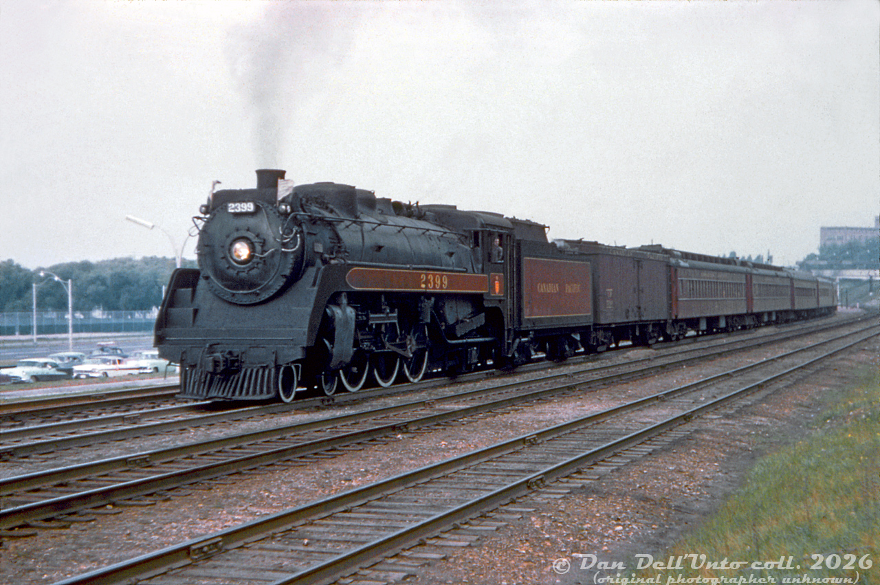 Canadian Pacific Railway G3g "Pacific" 2399 (built by CLC in September 1942, scrapped September 1961) flies white extra flags leading passenger train eastbound out of CN's Sunnyside Station, exercising running rights over CN's Oakville Sub enroute to Toronto Union Station.The train number wasn't listed on this slide, and the train consist appears to be different than the NYC-TH&B-CP train #322 (New York to Toronto) that John Street-based 2399 often operated on. The date also isn't listed on this slide, but it appears to be mid-to-late 1950's. Perhaps one of the RP.ca viewers more knowledgeable about 50's Toronto-area steam operations has some insight. Original photographer unknown (duplicate), Dan Dell'Unto collection slide.