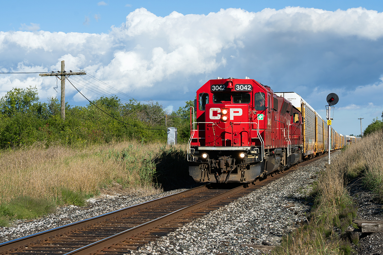 Thanks to good friends, I got a message about H17 going light up the Mactier, and later got an additional update about them lifting at Lambton... So...naturally, me and Isaac decided to follow him up the Mactier starting at mile 6...and after much confusion over the radio, and multiple plan changes over where H17 fit in between trains 112, 113, 114, and 421, we got ahead of him at Humber Station Rd and snapped a great frame of them knocking down the intermediates mile 24 in amazing afternoon light. Two GP38's (one a GP40X) full throttle, 7000 ft of autos, two determined railfans, and one great result...this shot.