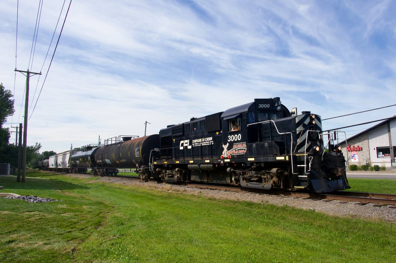 After dropping off 6 cars (for interchange with the Quebec Gatineau Railway), Chemin de fer Lanaudière with RS-18 3000 is heading north from Joliette, Qc with six cars on. This is an ex-CP line and 3000 is ex-CP. This obscure shortline (emphasis on short, it only has a single line which runs 8.6 miles) only runs once or twice a week and almost never on weekends.