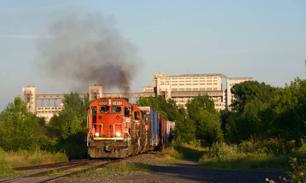 GTW 5820 is the leader on CN YRP003 as it heads towards Getpaq during some nice evening light as trailer CN 4134 smokes it up.