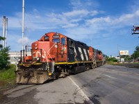 CN 4134 leads CN YRP002 over the Marien Avenue crossing.