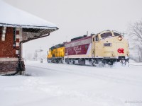 An afternoon snowstorm has blown in on OSR's Woodstock Job while working around its namesake town.  Cars have been pulled and spotted at the Roslin transload, and all outbound cars set out in the old Jellicoe yard tracks for CPKC to lift.  With freshly cleaned switches already filling back in, the crew takes their light power down to the east end of the yard, passing the 1899-built station, to lift inbound traffic.