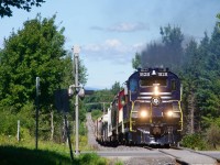 The Sartigan Railway has just left CN's Joffre Yard as it climbs a steep grade with a pair of RS-18s.