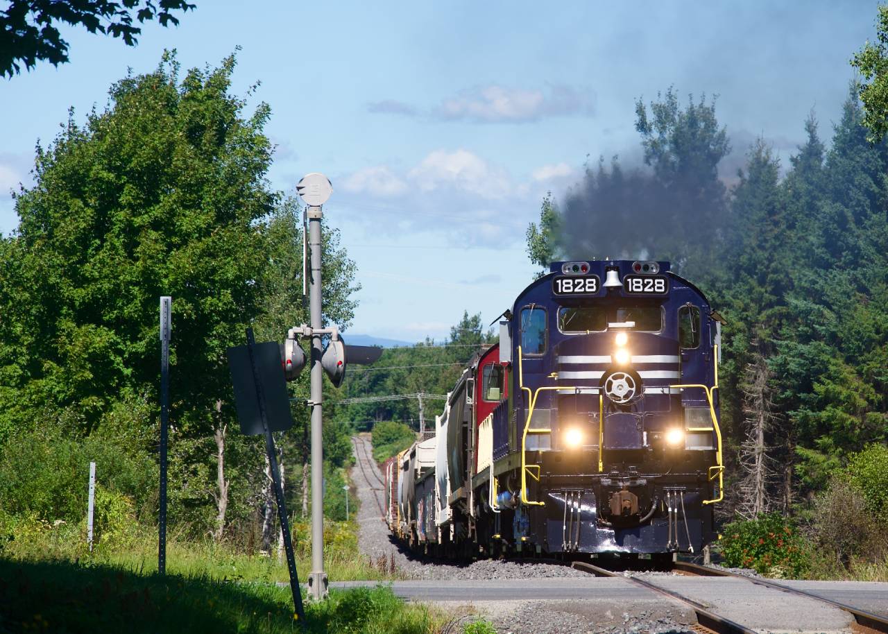 The Sartigan Railway has just left CN's Joffre Yard as it climbs a steep grade with a pair of RS-18s.