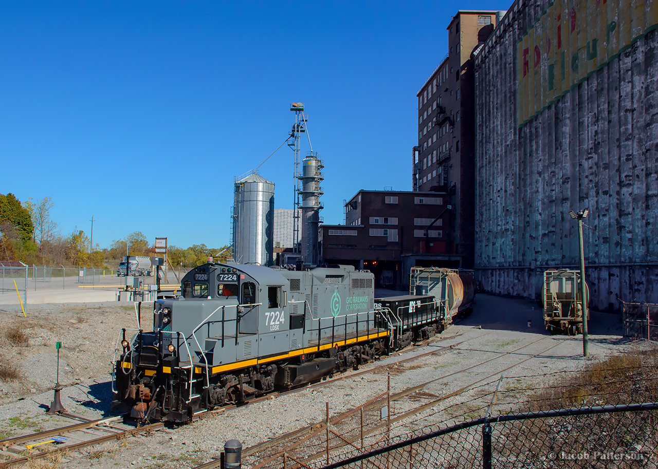 Where electrics once roamed. GIO's Welland job switches out cars for Ardent Milling, to be transloaded on the westernmost track at the London Agricultural Commodities elevator, the former Robin Hood facility.

Constructed in 1940, the Robin Hood Flour Mill received rail service from the Niagara, St. Catharines & Toronto Railway via a spur from their Welland Division mainline on Elm Street. An electric locomotive was based at the foot of Elm Street in Port Colborne as an outpost assignment, servicing this facility in what was then known as the community of Humberstone, amalgamating with Port Colborne in 1952. Electric service on the NS&T ceased in 1960, with CNR diesels taking over the assignment. The yard pictured contained only the main and east siding at the time, while over on Elm Street, a short stretch of the old NS&T main was kept south of Barrick Road for switching purposes. This arrangement remained until the connection at the north end of the elevator was constructed in 1983-1984 to the Canal Sub. Per Paul Duncan, this connection appears to have been the CN Casco Lead until being handed off to the Port Colborne Harbour Railway. The connection south to the former Dunnville Sub would be built in 1997 with startup of PCHR operations.

The Robin Hood Flour Mill would be closed in 2008 by Horizon Milling, and later sold to Ceres Global Ag in 2010 to be used primarily for grain storage and export. Space in the elevator would be leased to London Agricultural Commodities effective 2019, with LAC purchasing the facility in 2023. Shortly before the end of NS&T electric operations, this unit was built. Rolling out of GMDD London in 1955 as CNR 2013, this GP9 would be renumbered in 1956 to CN 4464. In 1986, it would be rebuilt as GP9RM 7224, and sold to Lambton Diesel Services in 2021.

Looking at 1930s aerial imagery, this site can be seen prior to the elevator's construction. Steve Host's recent research pointed out the abandoned right of way from the Welland Ship Canal Construction Railway. It would appear just north of the elevator location was a dump site for earth and other construction debris, and the construction "mainline" cut across the canal near this location. Comparing 1930s and 1940s imagery, one can see this track runs along the former construction railway right of way from the point where 7224 is seen above, right to the elevator silos.
