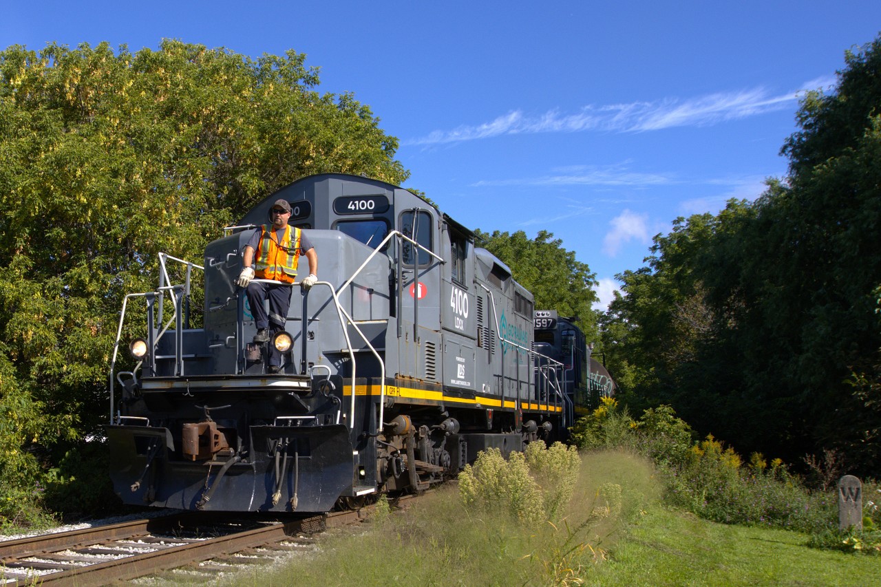 Having departed HOPA's Niagara Port Services Facility at Niagara Falls Road, LDSX 4100 LDSX 1597 with a mix of tanks, hoppers and boxcars head eastward on the Coniages Spur toward the former Hayes-Dana Plant facility.