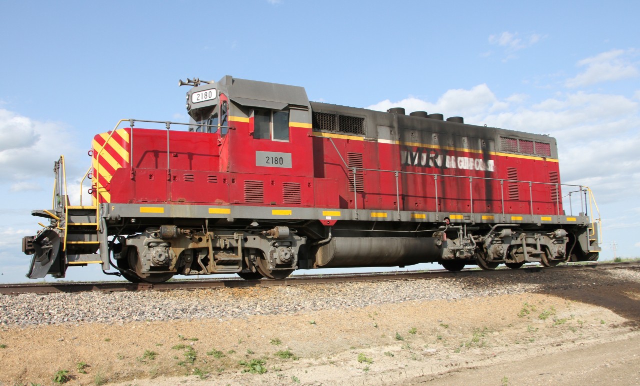 Mohall Railroad Inc. (MRI)(Northern Plains Railroad) EMD GP7. Faded and barely visible New Orleans & Gulf Coast Railroad markings are very faint. The paint is 5 years older than when she was last added to this site by Matt Watson. She was looking lonely so I gave her a bit of pixel love.