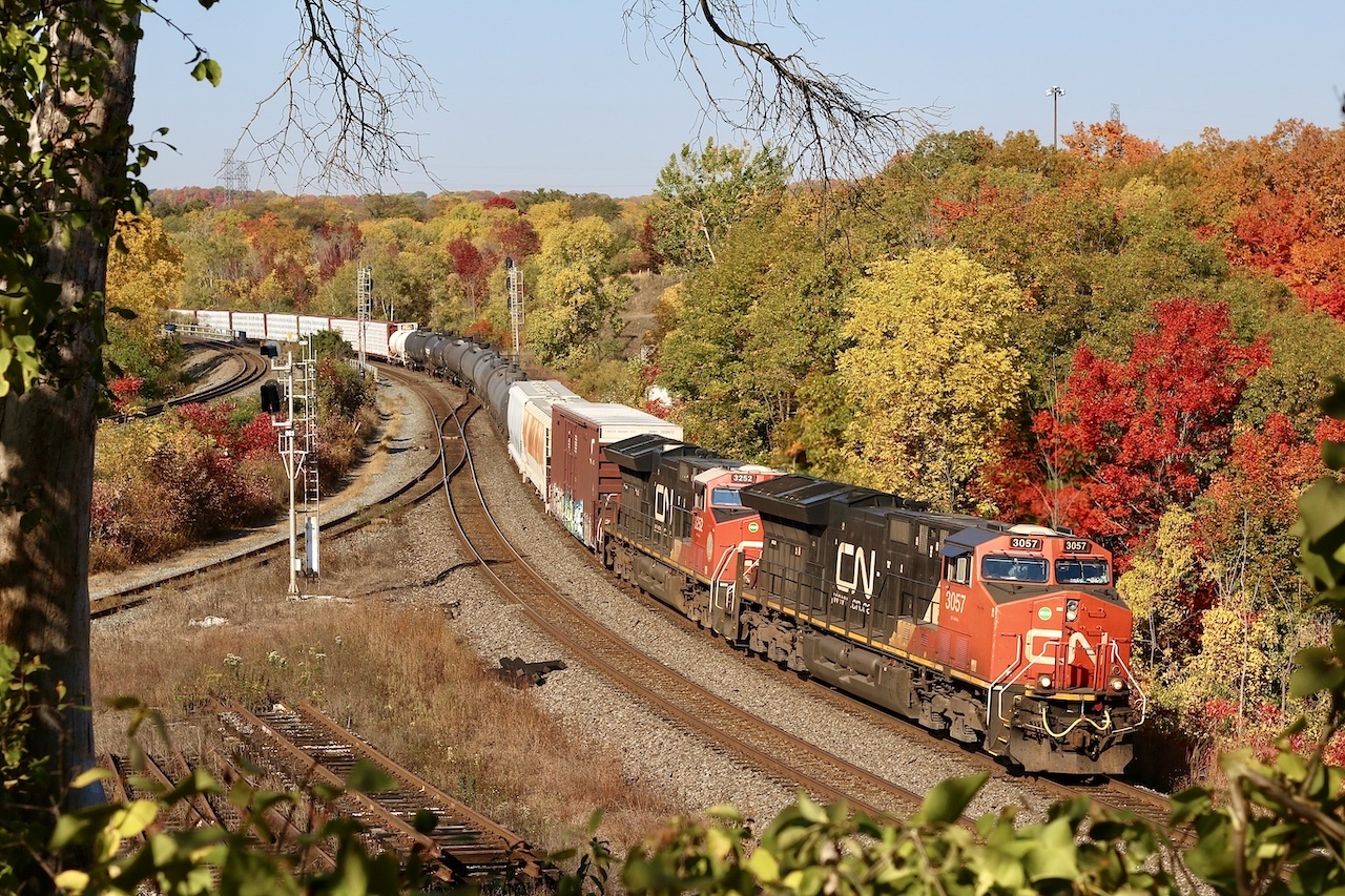 With autumn just around the corner I figured I’d post this shot from a few years ago at one of my favorite autumn spots. I’ve always loved hanging out here, taking in trains and nature, yet so close to the city. CPKC’s Hamilton subdivision is at the far left while the little used “cow path” is too the right of it. This spot was formerly CN Hamilton West but when the plant at Bayview Junction was expanded the name was dropped.