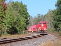 Southbound intermodal at was once the south siding switch of the Midhurst siding. The switch was removed in 2011. While a derail is still in place, a stop block was installed further up the spur.