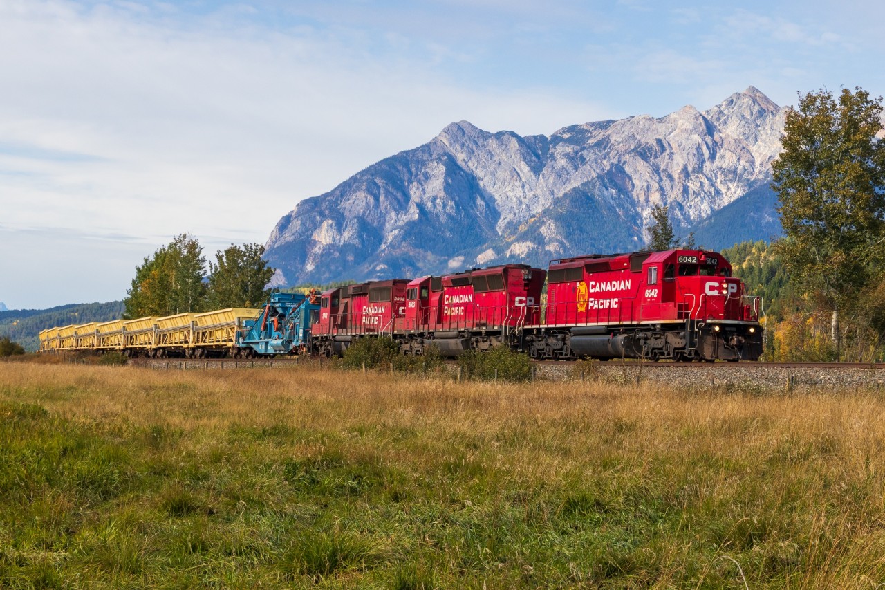Looking more like a ballast train than the classic Windy wayfreight, CP A19 starts its trek towards Trail with a familiar 3 pack of EMDs at the helm and a whole 12 ballast cars for their train.