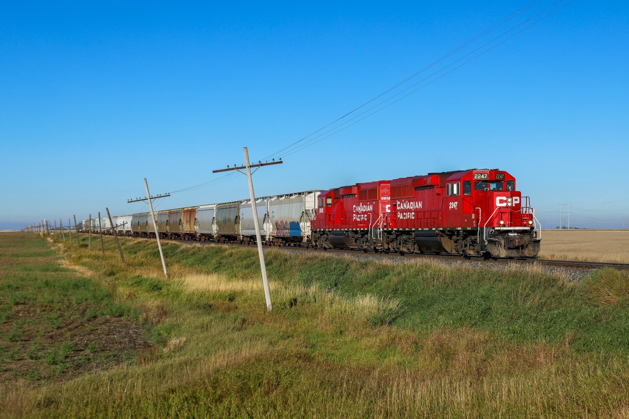 CPKC E36-19 highballs out of Pasqua with a pair of EMD GP20ECOs; CP 2247, CP 2212 and 24 cars. Next stop is Belle Plaine to do some work.