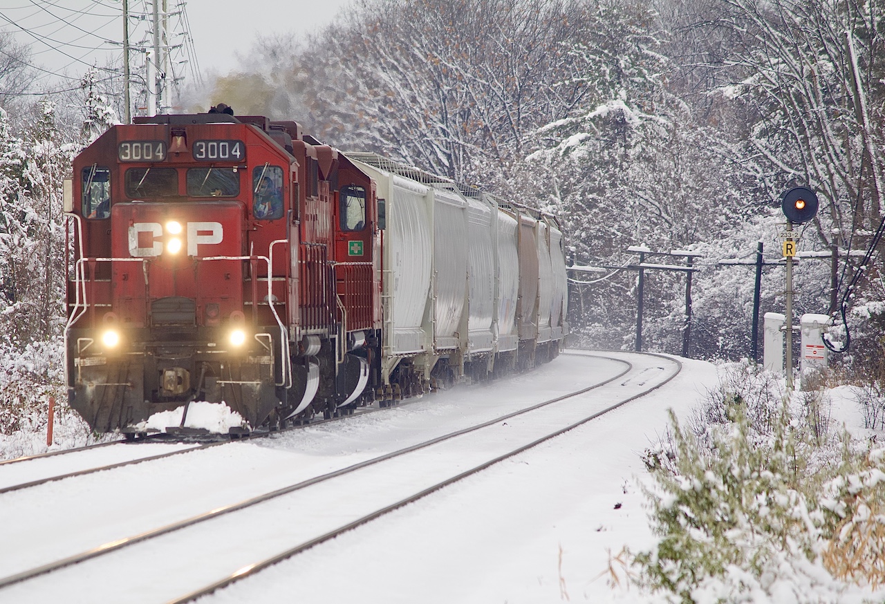 It’s hard to resist not heading out after a night of fresh snow. Another one of those GP38 shots. I alway liked CP’s small and unique fleet of GP38AC’s while they look very similar to run of the mill GP38’s they do have some different details along with being the oldest GP38’s on the roster. After spending most of their lives assigned to western Canada along with Vancouver Island they were finally scattered across the system several years ago. 3004 and 3005 received a special paint scheme while working on the island but when CP gave up the trackage they were gradually repainted back to full CP paint. Today the majority of the small fleet survives with only a few retired. It was nice having 3004 in Southern Ontario for a brief period before returning to the States. Here it and another GP roll east under fresh powder at Meadowvale after working Hornby yard. Back in 2020 H24 would work Streetsville yard before heading to Hornby and back home to Toronto. This explains the covered hoppers in the consist.