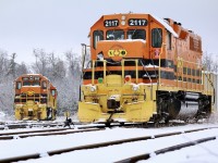 I’ve always had a thing for GP38’s, while maybe not the most exciting units they definitely deserve their praise for what they have done for the railroad industry. I especially like the less common versions like the GP38AC’s and rare PRSL dual control stand versions. In the end the Pennsylvania Reading Seashore Lines ordered 15 of these units with Penn Central ordered a handful. In the end they all went to Conrail and later most of the fleet split between CSX and NS. As they were non Dash-2 they were later sold off. It was a treat years ago crossing paths with this unit when it first arrived in Hamilton in Railtex paint, lettered NECR 3840. It was later repainted into GW paint and lettered RLHH 2117. Its dual control stand replaced and dynamic brakes added. For a period after CN took back Hamilton operations this unit was relocated to GEXR’s Guelph Junction Railway operations, before being sent out to Stratford. This day the fresh snow made the shot as power awaited the next call to duty at Guelph Junction.
