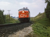 Running Toronto - North Bay via Beaverton, train 43 snakes through the curves of the Bala Sub just south of Mount Albert.

<br><br><i>Scan and editing by Jacob Patterson.</i>