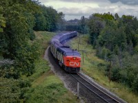 The day after shooting Friday only <a href=https://www.railpictures.ca/?attachment_id=59936>train 43 northbound</a> near Mount Albert, John is back in the S-curves shooting the equipment returning south as Saturday only train 56, North Bay - Toronto via  Beaverton.  These train are listed as summer only, operating June June 25 through September 5 for the 1964 season.

<br><br>Earlier that morning:
<br><a href=https://www.railpictures.ca/?attachment_id=57538>Train 52 departing Washago</a>
<br><a href=https://www.railpictures.ca/?attachment_id=59472>52 meets 409</a>


<br><br><i>Scan and editing by Jacob Patterson.</i>