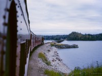 Shortly after departing Oba, ACR train 2 approaches the trestle over Lake Oba at roughly mile 212.5, a few miles south of Mosher.

<br><br><a href=https://www.railpictures.ca/?attachment_id=54251>Pausing at Oba</a>
<br><a href=https://www.railpictures.ca/?attachment_id=59048>The head end</a>
<br><a href=https://www.railpictures.ca/?attachment_id=59651>ACR meets CN</a>
<br><a href=https://www.railpictures.ca/?attachment_id=60063>New GP35s</a>

<br><br><i>Scan and editing by Jacob Patterson.</i>