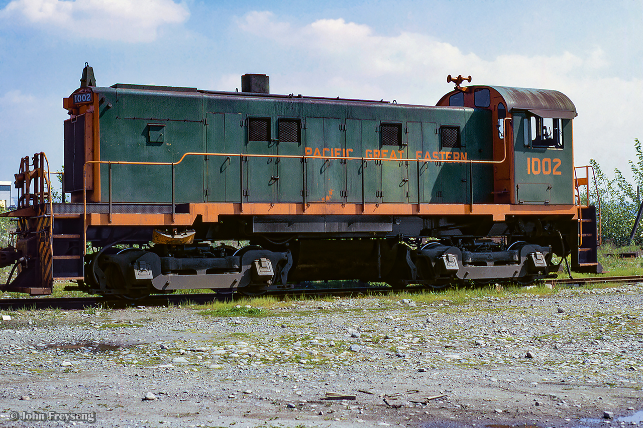 Sitting outside the Pacific Great Eastern diesel shop at North Vancouver is MLW S13 1002, built in 1959.  After service on the PGE and BC Rail, 1002 would become Vancouver Wharves 827, before heading east to Ontario as OSR 502.  Today, it survives on the Waterloo Central, as WCR 1002.