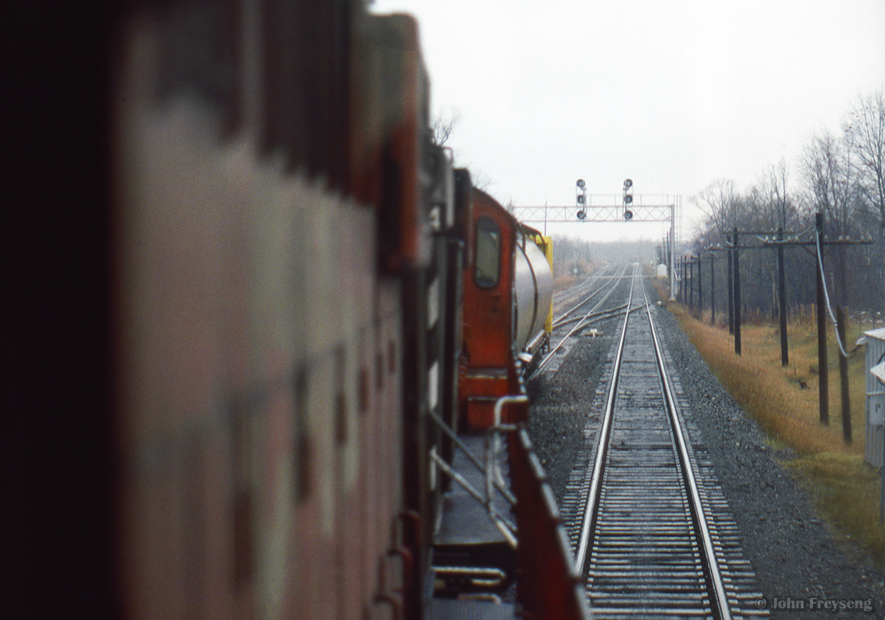 CP's Guelph Junction roadswitcher negotiates the crossovers at the east end of Guelph Junction, returning from work at Barnes Environmental International at Waterdown North.

Earlier that morning:
CP and GO tied down
Making up their train
A busy yard
Departing for Waterdown North

Scan and editing by Jacob Patterson.