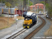 Pictured is the ETR's 1530 job crossing the CPKC Mainline, protected by the signal on a mast. Note the conductor a few cars back - the ETR folks work quick - they don't mess around. After switching cars near head office/walker yard, they brought a cut of cars directly to interchange with this feller riding all the way. Talk about terminal service! Note ETL 107 is a former EMD Demonstrator SW1500 former EMDX 113. What's the building in the background? is it related to customs or border protection?

