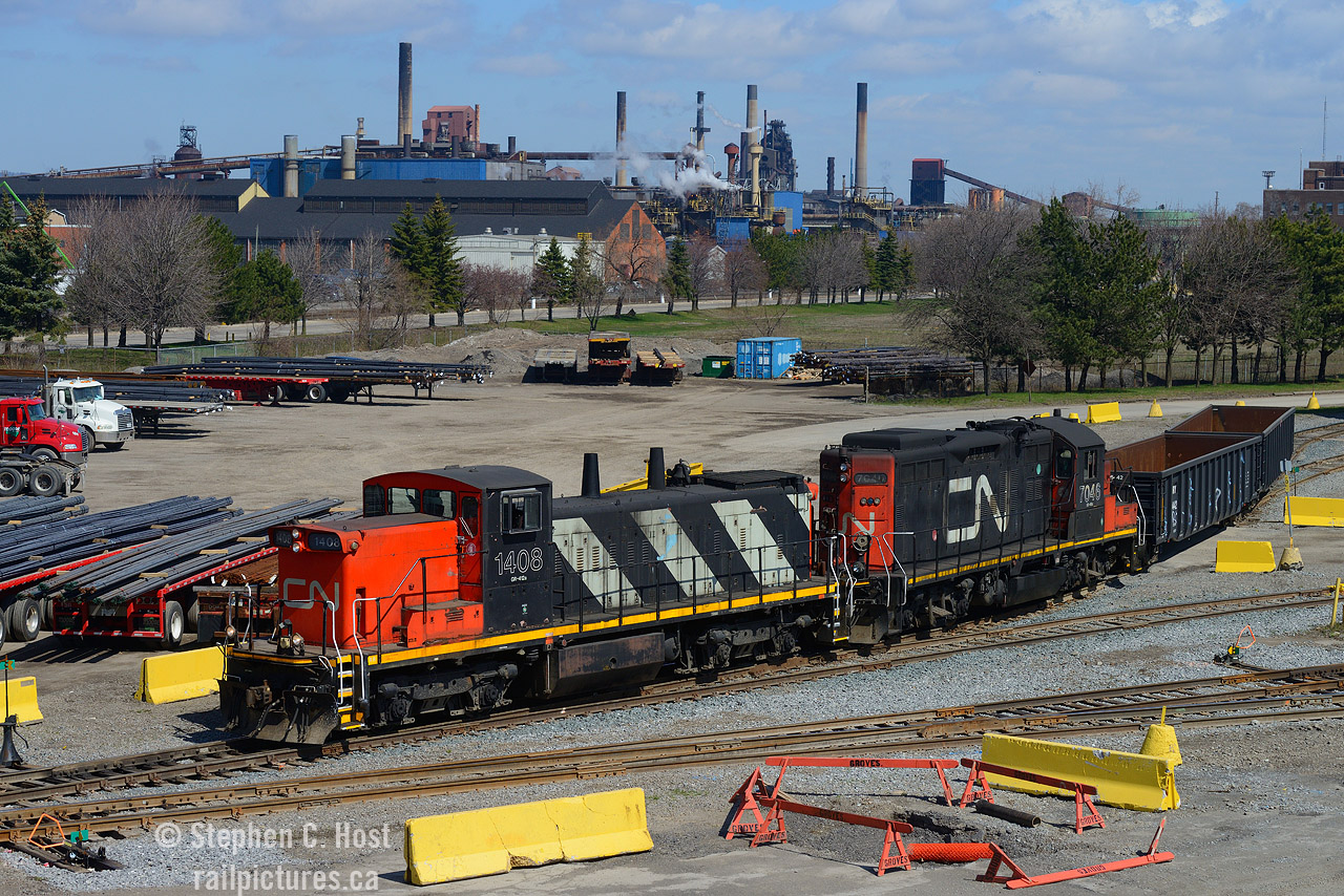 Steel: Before Tariffs, and that big orange oaf, steel was being shipped everywhere out of Hamilton, and pictured are two CN classics shoving a gondola into  the former Stelco Bar Mill now known as MANA, and in the background, is the still standing Stelco Blast furnaces. Today, MANA doesn't seem anywhere near as busy. Stelco of course has basically been razed to the ground save for the coke works, but the blast furnaces and half the buildings are gone.

Oh to do this again. We had it great in 2020. CN had just taken back a few branchlines and industrial railways in Ontario, and they put  all kinds of junk into service on the mainline  (Tim Stevens), as well on the branchlines - the GMD-1's were part of that  junk they re-activated in 2018/9 and used only until March/April 2021 - the last in revenue freight service was 1439 on April 22 2021. It was less than four years. (n.b: There was a Campus unit in Winnipeg which may qualify as the last active on CN - but not used in revenue service. Debate in the comments!). Where's CN 7046 these days?