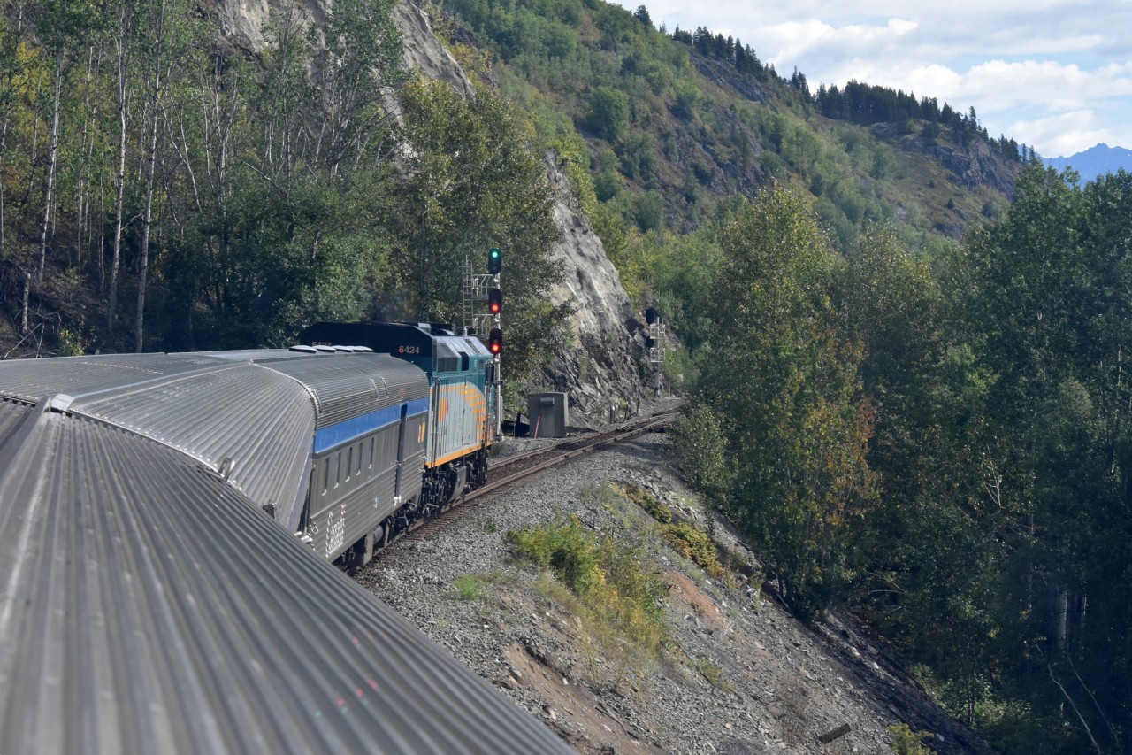 Ledge Rider  
VIA 006 The Skeena has a 'Clear Signal' at CN Andimaul, BC Mile 69.8 Bulkley Sub. 
Incredible landscape and scenery. Straight up on one side of the train, straight down on the other. There are some great views to be had from the Park Car dome as VIA 006 skirts along next to the Skeena River. 
The consist of VIA 006 for my return trip from Prince Rupert was 
VIA 6424 F40PH-2 locomotive 
VIA 8606 Baggage car 
VIA 8131 Economy coach 
VIA 8718 Yoho Park dome car