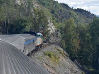 <b> Ledge Rider </b> <br>
VIA 006 The Skeena has a 'Clear Signal' at CN Andimaul, BC Mile 69.8 Bulkley Sub. <br>
Incredible landscape and scenery. Straight up on one side of the train, straight down on the other. There are some great views to be had from the Park Car dome as VIA 006 skirts along next to the Skeena River. <br>
The consist of VIA 006 for my return trip from Prince Rupert was <br>
VIA 6424 F40PH-2 locomotive <br>
VIA 8606 Baggage car <br>
VIA 8131 Economy coach <br>
VIA 8718 Yoho Park dome car


