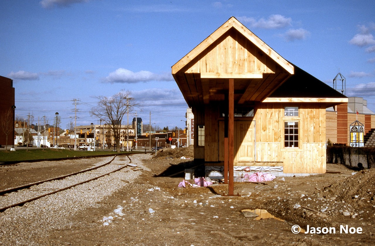 The future Waterloo-St. Jacobs Railway (WSJR) station is pictured during its construction in the spring of 1996 in downtown Waterloo, Ontario situated along the Waterloo Spur. The previous year, the Regional Municipality of Waterloo had purchased the line’s corridor from CN to preserve it for future use. The following year, WSJR began operating tourist trains between the new station in Waterloo to St. Jacobs with occasional trips to Elmira.