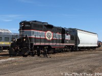 Even a shortline can be busy when there's work required. After their run up from Streetsville to interchange traffic, Orangeville-Brampton Railway's lone power, CCGX GP9 1000, switches the single hopper brought back on <a href=https://www.railpictures.ca/?attachment_id=59877><b>the return trip</b></a> onto a cut of cars in the yard. Conductor Steve Bradley is diligently riding the end of the hopper to make the joint, while engineer Wayne leans out of the cab window and works the controls of his 1957 London-built steed. A fuel truck from the local fuel dealer would soon show up to fill the Geep, and after some <a href=https://www.railpictures.ca/?attachment_id=58339><b>light servicing</b></a> by the crew, 1000 would be put away for the day. In the background, ex-VIA Rail <a href=https://www.railpictures.ca/?attachment_id=59423><b>RDC-9 6006</b></a> sits on the station track coupled to the rest of the <a href=http://www.railpictures.ca/?attachment_id=698><b>Credit Valley Explorer</b></a> consist, that was receiving some attention from a few individuals before its next upcoming tourist excursion.