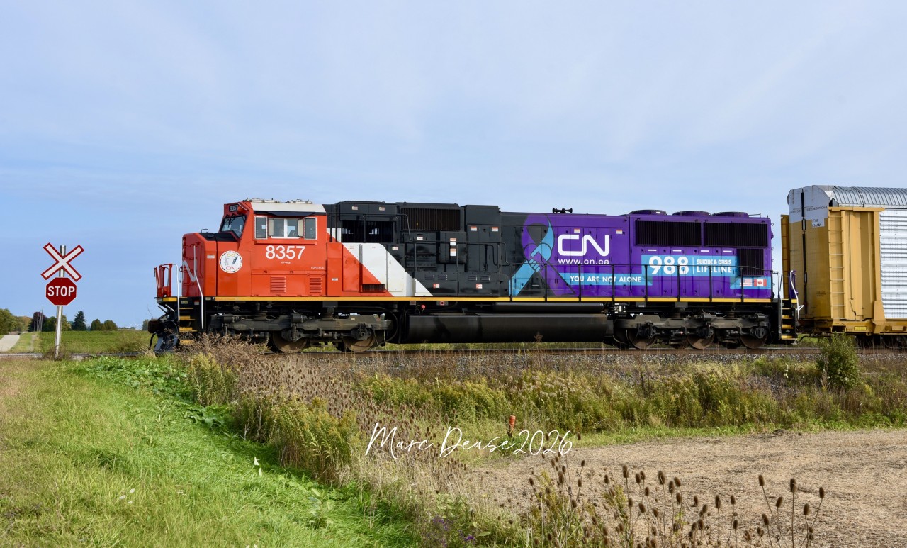 An early morning surprise on Train 275 heading west bound on the Strathroy Sub at South Plympton Line with the CN 8357 "Suicide & Crisis Lifeline" solo leader, October 10, 2026.