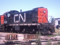 A relic from the past. CN MLW S-3 #8490 is seen past its active days languishing at the end of a storage track in London's Rectory St reclamation yard on a nice warm June day. The whole series, 8400-8498, were gone from the roster by 1975. These units were built between 1951 and 1954.