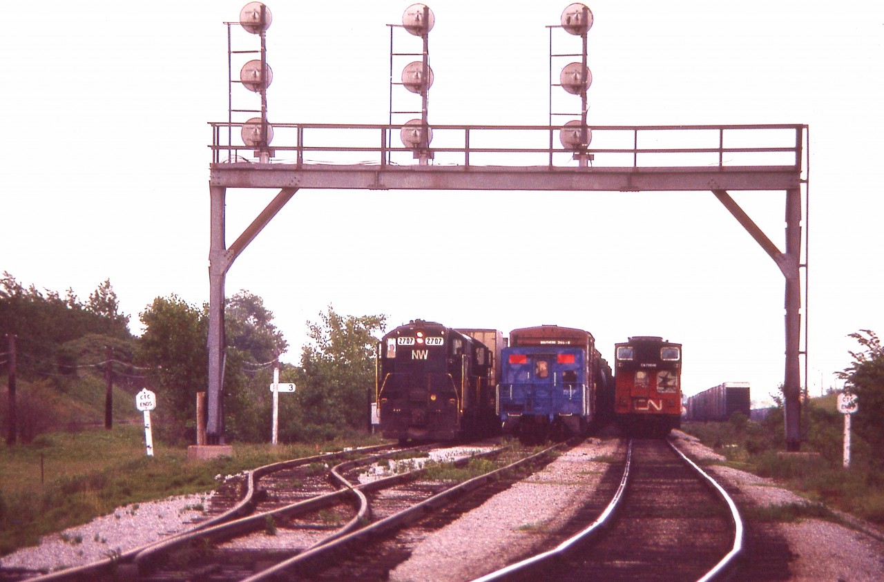 No room at the Inn.   The CN came in a while before I arrived at CN Duff (as you can see, Mile 3 Stamford Sub) and the Conrail caboose is on the end of a train rolling in, while the N&W 2707 is about to lead a train westbound.
Far cry from today's activity; which, most of the time, is closer to nil.