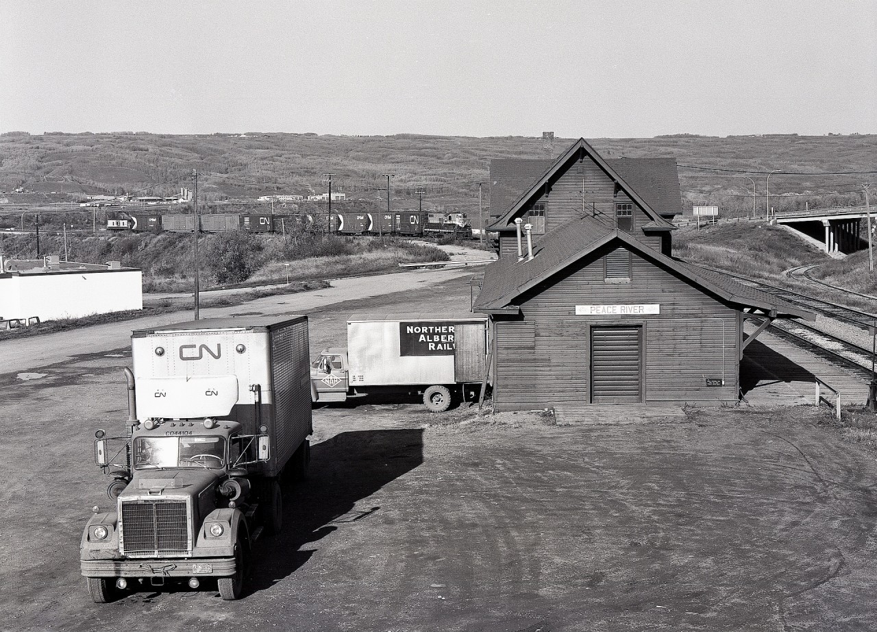 With a CN truck foretelling an ownership change just over three months ahead, operations at the Northern Alberta Railways depot at Peace River continued, with NAR 209 bringing the homeward-bound Hines Creek wayfreight into town on Saturday 1980-09-27.

That depot is a survivor, built in 1916 and a Visitor Information Centre today.