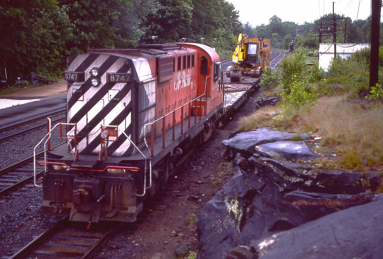 MLW RS-18 #8747 with a work train seen at the end of the day. It would overnight and head out south in the morning. Image taken directly opposite the CP Parry Sound station.